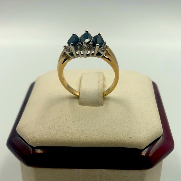 Dark sapphire with small diamonds on a 10K gold ring. - Picture 1 of 3
